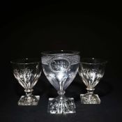 A LARGE GEORGIAN LEMON-SQUEEZER FOOTED RUMMER AND A PAIR OF RUMMERS. (3).