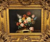 M. Paules (20th century) Still life of flowers on a marble ledge, signed, oil on board, 29 x 39.5cm