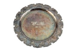 A George V silver salver, with shaped c-scroll and foliate border, engraved monograms and date