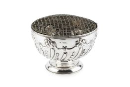 A late Victorian silver rose bowl, with spirally lobed and foliate embossed decoration, by William
