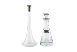 A late Victorian silver mounted glass decanter, of tall, slender design with spreading circular