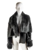 A Dom and Ruby, London, sheepskin jacket in black, featuring one large button at the front and a
