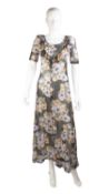 A BIBA feminine long fine dress of fine quality cotton, in lilac, yellow, green and black colours in