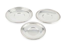 An American silver circular plate, by F. B. Rogers Silver Co, 26cm diameter, and two further