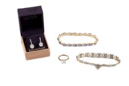 A tanzanite and diamond bracelet, designed as a line of pear-shaped mixed-cut tanzanites in claw