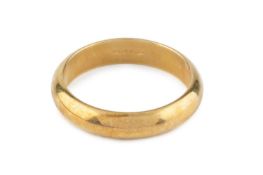 A yellow precious metal wedding band, of D-section profile, stamped '750', ring size P Gross