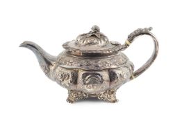 A George IV silver teapot, embossed with flowers and foliage and having rose finial, the handle with