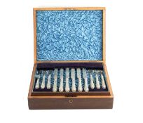 A set of eighteen late Victorian silver plated dessert knives and forks, with engraved decoration,