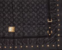 A Louis Vuitton silk scarf Featuring the iconic monogram design. Grey tones. 100% silk. 90cm x