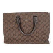 A GUCCI leather business tote in GG canvas and dark brown, Made in Italy L. 43cm, D. 11cm, H.30cm.