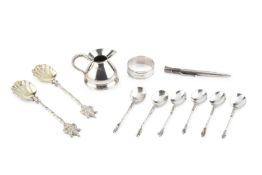 A pair of late Victorian silver presentation spoons, with scalloped bowls and armorial terminals, by