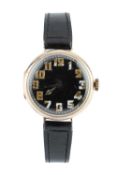 A wristwatch, the circular black dial with luminous Arabic numerals, to a jewelled manual-wind
