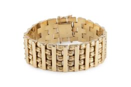 A fancy-link strap bracelet, of part-textured design, stamped '585' with Austrian gold mark,