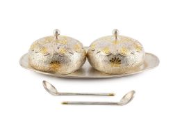 A pair of Korean circular boxes and covers, of compressed form, relief decorated with stylised
