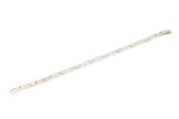 A stone set fancy-link bracelet, centred with a trio of white stone set lozenge-shaped links,