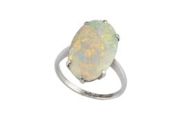 An opal single stone ring, the oval cabochon opal in claw setting, white precious metal mounted,
