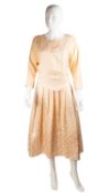 A Benny Ong, International, 1980's ladies dress and jacket in pale pink, the dress with tie-up