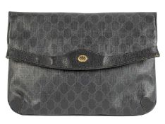 A black Gucci clutch bag in GG Monogram coated fabric with foldover flap and popper fastening, L.