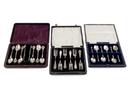 A set of six late Victorian silver teaspoons, with matching sugar tongs, having twist stems with