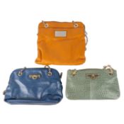 A DKNY mustard orange leather handbag with silver hardware details and a satin lining; An ocean blue