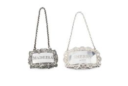 An early Victorian silver decanter label for Madeira, with fruiting vine embossed border and
