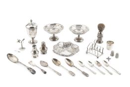 A collection of silver, comprising a faceted sugar caster, Chester 1939, 12.5cm high, a pierce