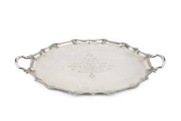 A George V silver twin handled tea tray, of shaped oval outline, having engraved masonic