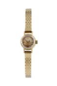A lady's bracelet watch by Omega, the circular dial with baton markers, to a jewelled manual wind
