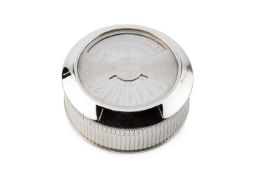 A silver plated perpetual desk calendar by Cartier, of circular form with ridged sides and