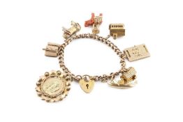 A charm bracelet, the hollow curb-link bracelet with padlock clasp stamped '9CT', suspending eight
