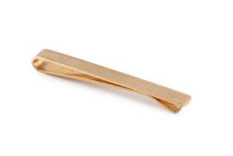 A 9ct gold tie bar, of engine-turned design, hallmarked for Birmingham 1968, length 5.6cm Gross
