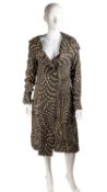 A VIVIENNE WESTWOOD, 2010 adaptable knee length coat or dress, in a simple yet striking black and