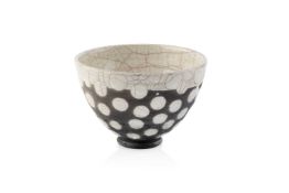 A studio pottery small bowl, with ivory crackle glazed interior and spotted exterior, indistinct