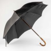 A Brigg London 'Swaine Adeney Brigg, Traveller' umbrella with a silver band, a silk canopy and a