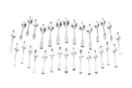 A collection of mainly 19th century silver fiddle pattern flatware, comprising 7 dessert spoons