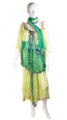 A Carol Lee ensemble of beach wear of a Hawaiian theme consisting of a chiffon top, skirt and