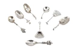 A Dutch silver caddy spoon, the shovel shaped bowl embossed with a milkmaid in a landscape, and