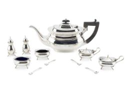A George V silver teapot, with ebonised handle and knop, by Cooper Bros & Sons Ltd, Sheffield
