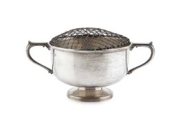 An Edwardian silver twin handled rose bowl, with angular scroll capped handles, on pedestal foot, by