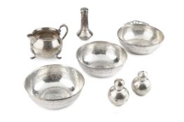 An American silver porringer, with angular pierced handle, stamped 'Cartier', 12.5cm diameter,