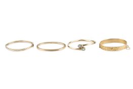 A 9ct gold bangle, of hinged oval form, with foliate scroll engraved decoration, together with a 9ct
