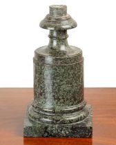 A serpentine marble stand