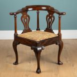 A George III mahogany corner chair