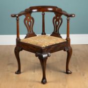 A George III mahogany corner chair