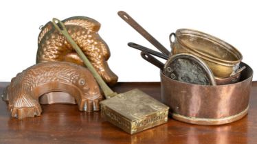 A collection of copper and brass kitchenware