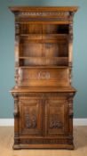 A Continental oak dresser with decorative carving
