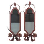 A pair of wrought iron girandole mirrors
