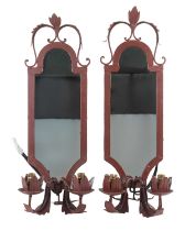 A pair of wrought iron girandole mirrors