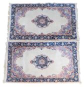 A pair of Persian-style rugs