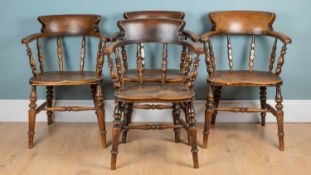 A harlequin set of four smokers' chairs